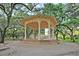 Picturesque gazebo surrounded by mature trees, providing a serene and inviting outdoor space at 154 Wentworth St, Charleston, SC 29401