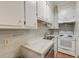 Efficient kitchen featuring white cabinets, tile backsplash, and stainless steel appliances at 154 Wentworth St, Charleston, SC 29401