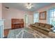Cozy living room with a decorative rug, piano, and comfortable seating arrangement at 154 Wentworth St, Charleston, SC 29401