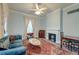 Cozy living room with a marble fireplace, classic furniture, and bright, airy windows at 154 Wentworth St, Charleston, SC 29401