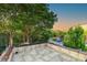 Tiled outdoor patio with mature tree views at 154 Wentworth St, Charleston, SC 29401