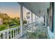 Covered porch with table and chairs, neighborhood views at 154 Wentworth St, Charleston, SC 29401