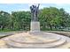 Monument featuring sculptural figures standing upon a multi-tiered circular base with trees in the background at 154 Wentworth St, Charleston, SC 29401