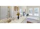 Bathroom features double vanity, soaking tub, decor and natural light at 1576 Pine Grove Rd, Ruffin, SC 29475