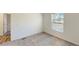 This bedroom boasts neutral walls, plush carpet, and a window for plenty of natural light at 1576 Pine Grove Rd, Ruffin, SC 29475