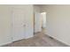 Bright bedroom with neutral carpet, white walls and white doors at 1576 Pine Grove Rd, Ruffin, SC 29475