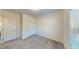 Bright bedroom with neutral carpet, white walls and a large window at 1576 Pine Grove Rd, Ruffin, SC 29475