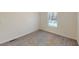 Neutral bedroom has a large window that provides natural light at 1576 Pine Grove Rd, Ruffin, SC 29475