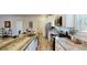 Modern kitchen features a large island with sink, stainless steel appliances, and granite countertops at 1576 Pine Grove Rd, Ruffin, SC 29475