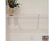 The laundry room features a wire rack shelf and a decorative flower pot on top at 1576 Pine Grove Rd, Ruffin, SC 29475
