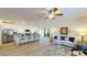 Bright, open-concept living space with modern furnishings adjacent to a spacious kitchen at 1576 Pine Grove Rd, Ruffin, SC 29475