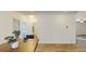 Open floor plan features vinyl floors with a hall bathroom and a view of the kitchen island in the distance at 1576 Pine Grove Rd, Ruffin, SC 29475