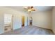 Spacious primary bedroom with soft carpet flooring, ensuite bath, and a walk-in closet at 1576 Pine Grove Rd, Ruffin, SC 29475