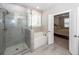 Bathroom features a glass enclosed shower and a soaking tub with view to bedroom at 158 Boots Branch Rd, Summerville, SC 29485