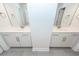 Bathroom boasts separate vanities with tile floors, bright mirrors, and modern fixtures at 158 Boots Branch Rd, Summerville, SC 29485