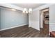 Open dining room featuring hardwood floors, neutral paint, and decorative trim at 158 Boots Branch Rd, Summerville, SC 29485