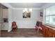 Bright dining room with decorative trim, hardwood floors, and elegant lighting at 158 Boots Branch Rd, Summerville, SC 29485