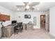 Home office setup with a large desk, chair, computer, and natural light at 158 Boots Branch Rd, Summerville, SC 29485