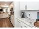 Modern kitchen featuring white cabinets, granite countertops, and stainless steel appliances at 158 Boots Branch Rd, Summerville, SC 29485