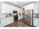 Modern kitchen with stainless steel appliances, granite countertops, and ample storage space at 158 Boots Branch Rd, Summerville, SC 29485