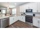 Well-appointed kitchen with white cabinets, granite countertops, and stainless steel appliances at 158 Boots Branch Rd, Summerville, SC 29485