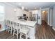 Bright kitchen features granite counters, stainless appliances, and island with seating at 158 Boots Branch Rd, Summerville, SC 29485