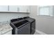 The laundry room has a front-loading washer and dryer at 158 Boots Branch Rd, Summerville, SC 29485