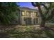 A twilight view of a condo building with balconies featuring plants and flowers at 160 High Hammock Villas, Seabrook Island, SC 29455