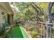 Spacious covered balcony offering cozy seating and decorated with flowerpots at 160 High Hammock Villas, Seabrook Island, SC 29455