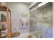 Modern bathroom featuring a tiled glass shower, neutral colors, and decorative accessories at 160 High Hammock Villas, Seabrook Island, SC 29455