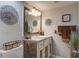 Well-lit bathroom featuring decorative mirror and ample counter space at 160 High Hammock Villas, Seabrook Island, SC 29455