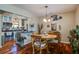 Charming dining room features hardwood floors, a pendant light, and access to the kitchen at 160 High Hammock Villas, Seabrook Island, SC 29455
