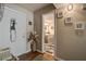Inviting entryway with decor and leads into a bathroom with tiled accents at 160 High Hammock Villas, Seabrook Island, SC 29455