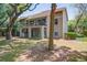 Inviting two-story condo featuring dual balconies and lush surrounding landscaping at 160 High Hammock Villas, Seabrook Island, SC 29455