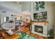 Bright living room with a stone fireplace, high ceilings, and ample natural light at 160 High Hammock Villas, Seabrook Island, SC 29455