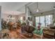 Open-concept living space with hardwood floors, a fireplace, and access to outdoor views at 160 High Hammock Villas, Seabrook Island, SC 29455