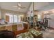 Bright bedroom with vaulted ceiling, ceiling fan, wooden bed frame, and large sliding glass door at 160 High Hammock Villas, Seabrook Island, SC 29455
