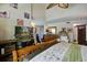 Bright bedroom with vaulted ceiling, ceiling fan, wooden bed frame, and large sliding glass door at 160 High Hammock Villas, Seabrook Island, SC 29455