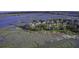 Aerial view of marshfront community with docks and water access at 1637 Folly Creek Way # E-12, Charleston, SC 29412