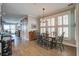 Inviting dining room with ample natural light and hardwood floors at 1637 Folly Creek Way # E-12, Charleston, SC 29412