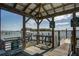 View of a private boat dock with boat lift surrounded by scenic waterfront and open sky at 1637 Folly Creek Way # E-12, Charleston, SC 29412