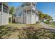 Stylish raised beach house with covered parking, stairway and fenced yard at 1637 Folly Creek Way # E-12, Charleston, SC 29412
