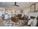Open floor plan with living room, dining area, and kitchen with white cabinets and stainless appliances at 1637 Folly Creek Way # E-12, Charleston, SC 29412