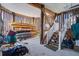 Spacious covered storage area with natural wood framing, stairs, and ample room for watercraft at 1637 Folly Creek Way # E-12, Charleston, SC 29412