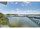 Scenic waterfront view with docks, boats, and lush green surroundings under a bright blue sky at 1637 Folly Creek Way # E-12, Charleston, SC 29412