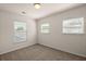 Bright bedroom featuring three windows allowing for ample natural light and neutral carpet at 168 Keaton Brook Dr, Summerville, SC 29485