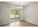 Dining area featuring modern chandelier and sliding glass door to the outdoor patio at 168 Keaton Brook Dr, Summerville, SC 29485