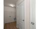 Laundry room with hookups, laminate flooring, white walls, and a built in shelf at 168 Keaton Brook Dr, Summerville, SC 29485