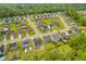 An aerial view shows an attractive neighborhood with sidewalks and well-maintained lawns near mature trees at 1728 Refuge Dr, Ladson, SC 29456