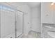 This is a bathroom featuring a glass shower, and granite top on the vanity with tile flooring at 1728 Refuge Dr, Ladson, SC 29456